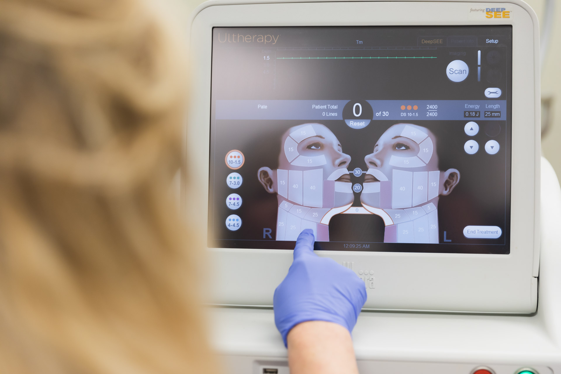 A provider adjusts the device settings during a patient's appointment for Ultherapy near Franklin.