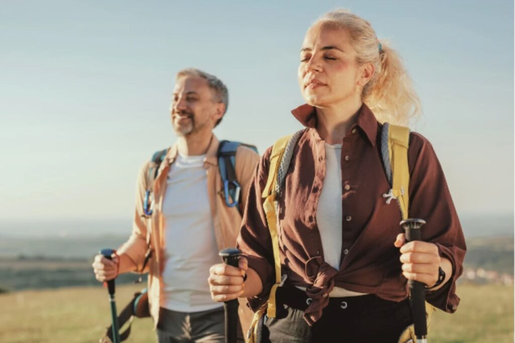 man and woman hiking and being active hormone replacement