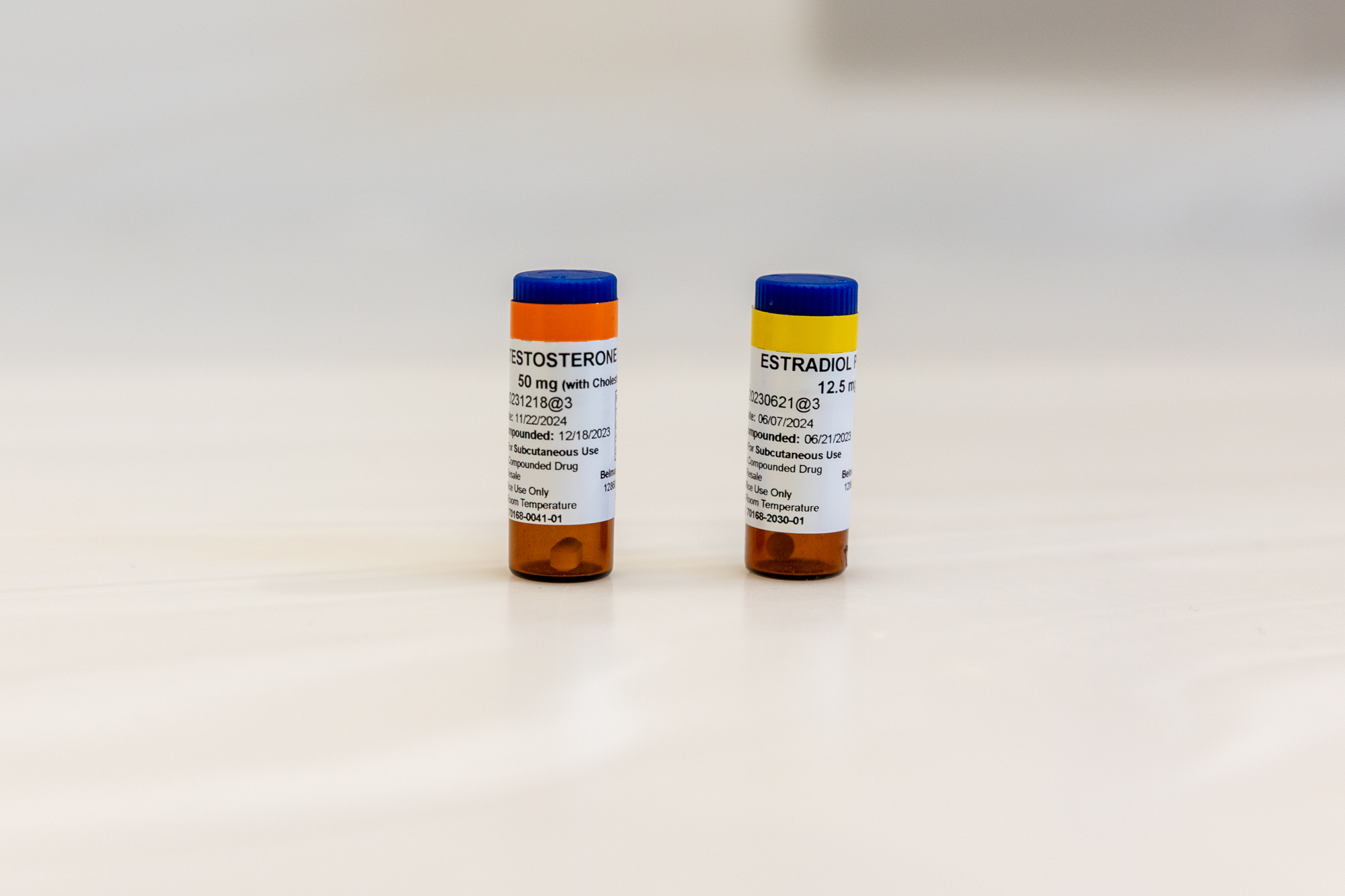 2 bottles of hormone replacement therapy near Belle Meade on a white table.