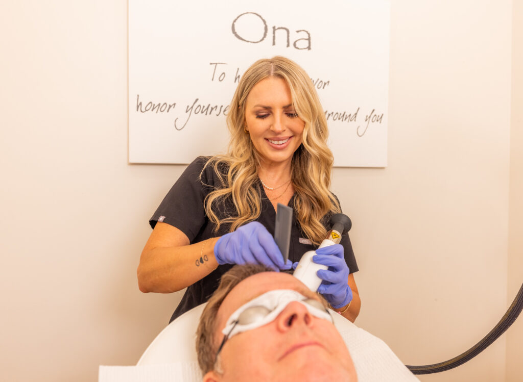 An Ona Skincare team member administering hair restoration near Belle Meade.