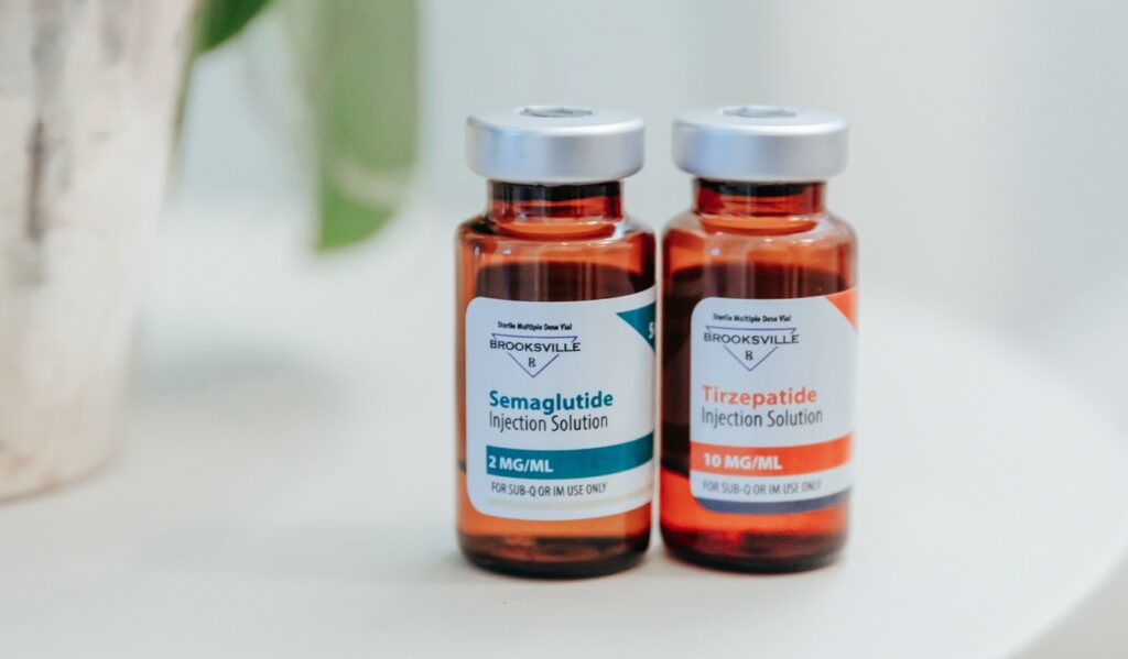 2 bottles of different types of Medical Weight Loss in Nashville, semaglutide and tirzepatide, sitting on a white counter.