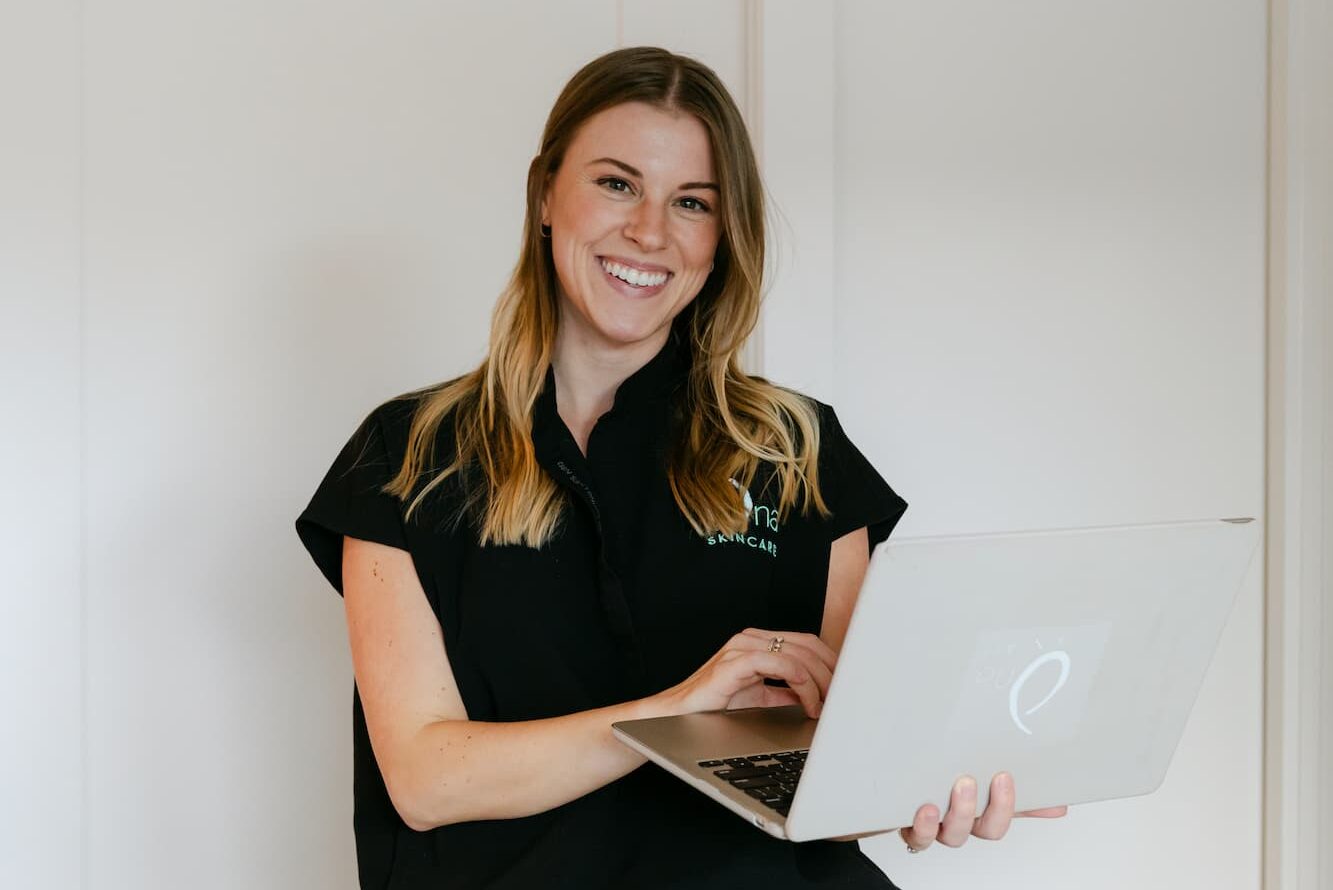 Grace Brenner, lead practitioner at our weight loss clinic near Franklin, smiles while reviewing patient forms. 
